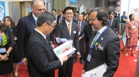 Giving an example of FDI publication Oral Health Atlas to Singapore Ministry of Health.